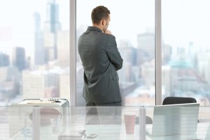 Businessman-thinking-in-office