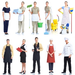 Young  smiling waiter chef and cleaner. Isolated over white back